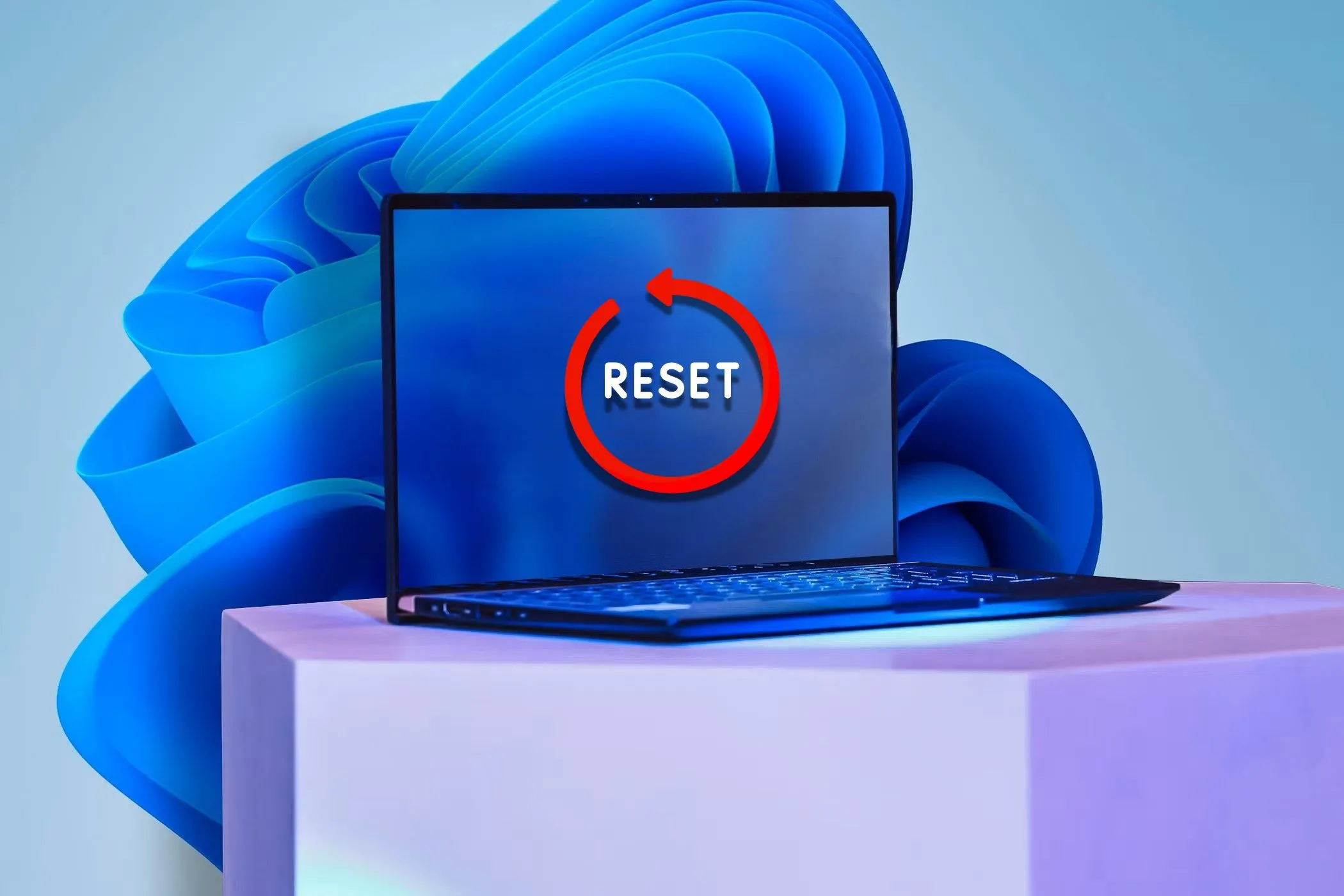 Laptop với nhãn 'Reset' trên màn hình, tượng trưng cho việc định dạng lại thiết bị để loại bỏ phần mềm độc hại dai dẳng.