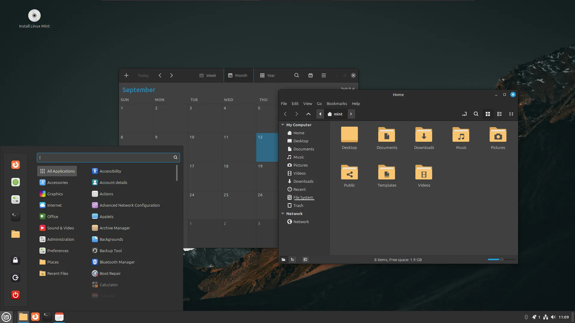 Màn hình desktop Linux Mint với ứng dụng lịch và trình duyệt tệp đang mở, thể hiện giao diện thân thiện